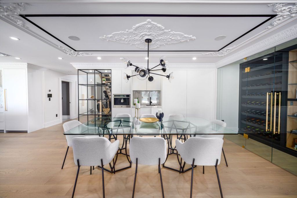 A modern high-end dining room with a wine cellar attached